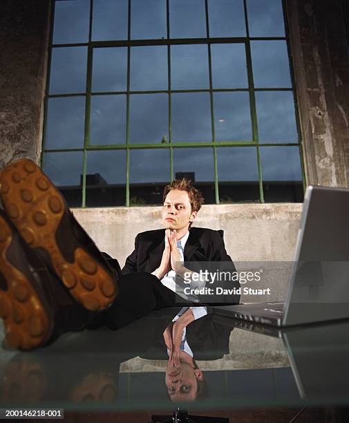 young businessman propping feet on desk - soles pose stock pictures, royalty-free photos & images