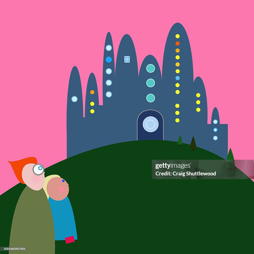 Two figures looking at building on hill