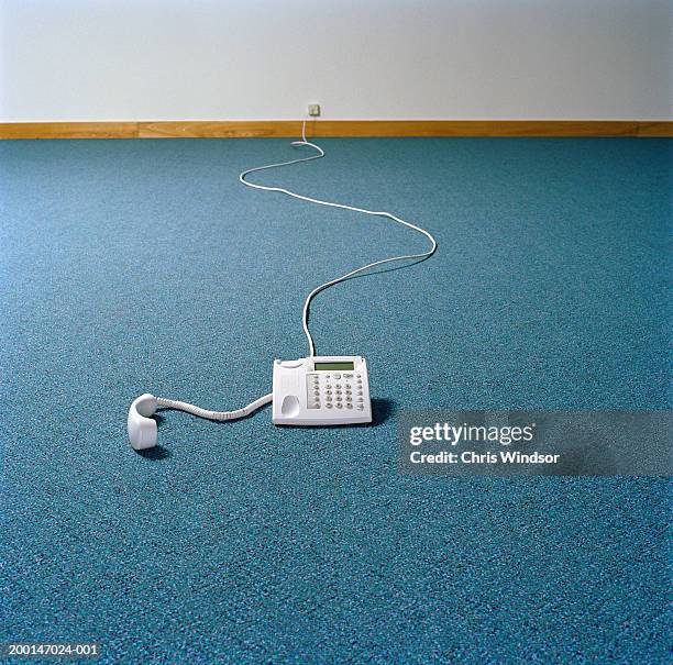 Telephone on floor of empty room