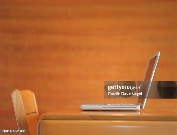 laptop computer on table, side view - laptop side view stock pictures, royalty-free photos & images