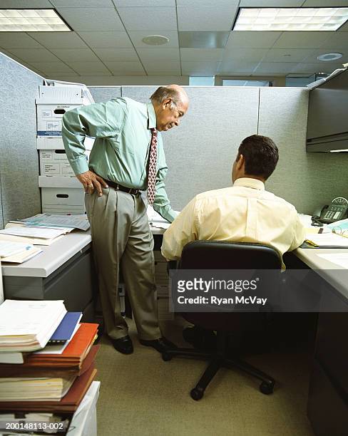 businessmen in office cubicle, having meeting - office partition stock pictures, royalty-free photos & images