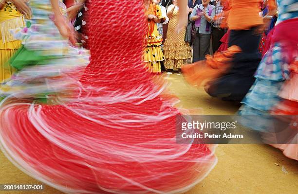 flamenco dancers spinning, low section (blurred motion) - flamencos stock pictures, royalty-free photos & images