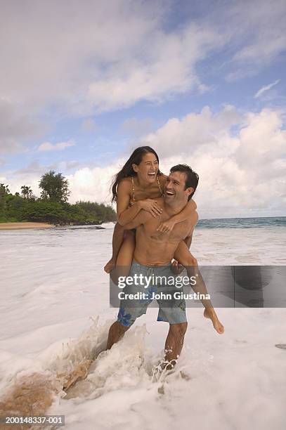 Man Giving Young Woman Piggyback Ride Smiling Side View High-Res Stock  Photo - Getty Images