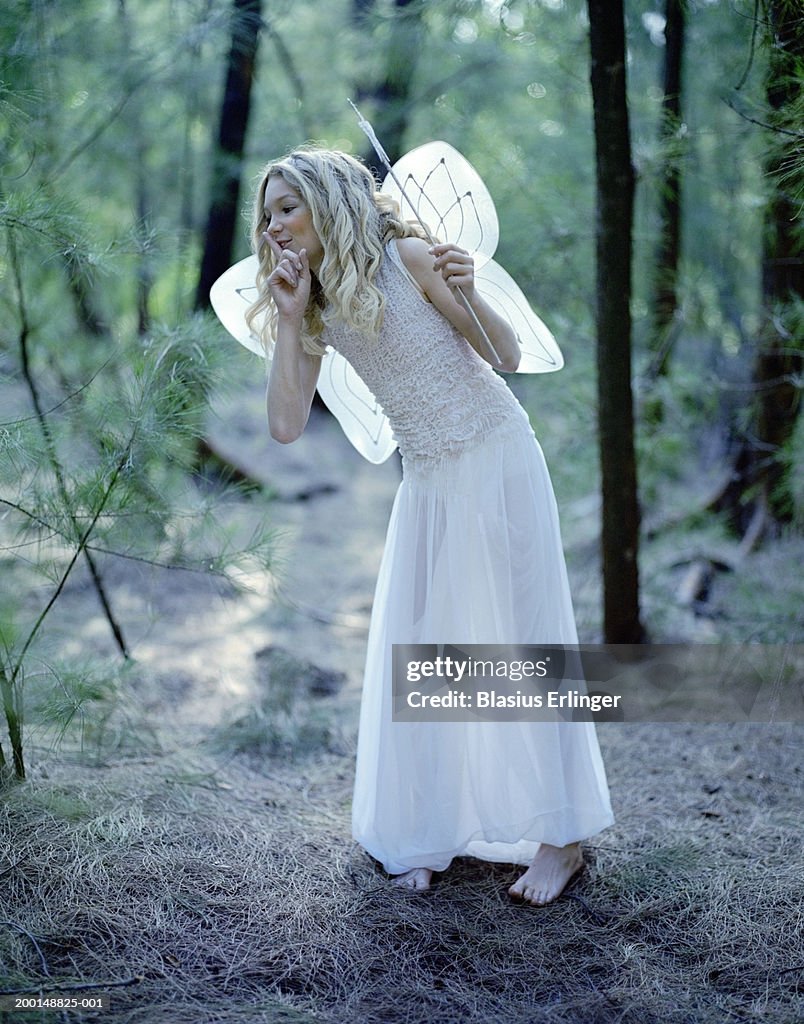 Teenage girl (14-16) wearing fairy costume