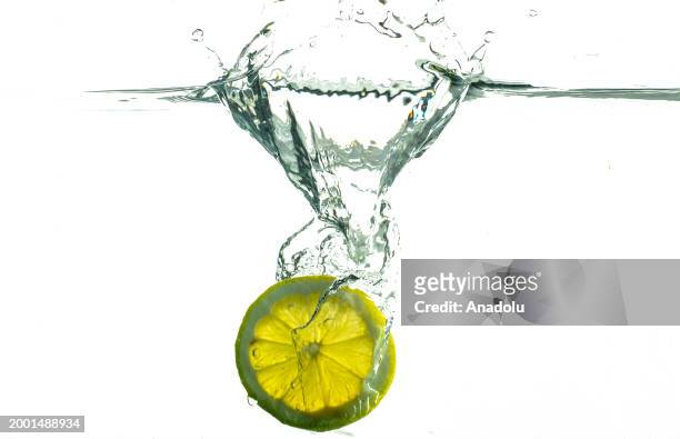 Slice of a lemon is seen after splashing in water in Ankara, Turkiye on February 07, 2024.