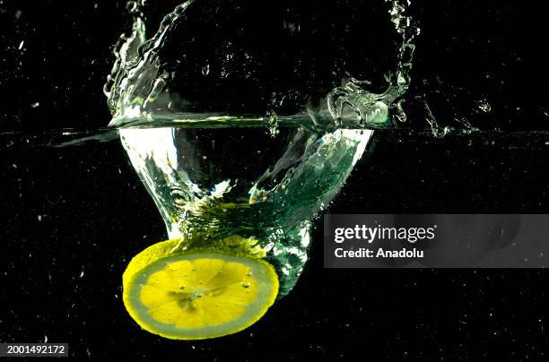 Slice of a lemon is seen after splashing in water in Ankara, Turkiye on February 07, 2024.