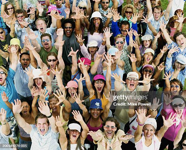 People Ruffling Crowd Of Young Adults Yelling Raising Hands In Air Portrait High-Res ...