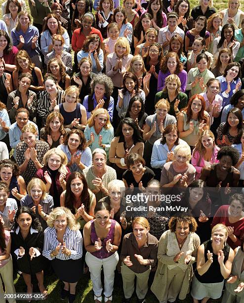 crowd of women clapping, portrait, elevated view - ovación de pie fotografías e imágenes de stock