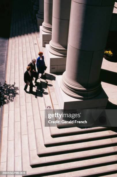 three businesspeople walking up steps of courthouse, elevated view - courthouse bildbanksfoton och bilder