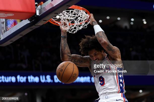 Kelly Oubre Jr. #9 of the Philadelphia 76ers dunks against the Washington Wizards during the second half at Capital One Arena on February 10, 2024 in...