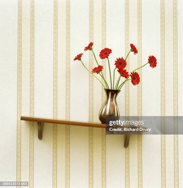 vase of gerberas on crooked shelf (digital enhancement) - inclinando se fotografías e imágenes de stock