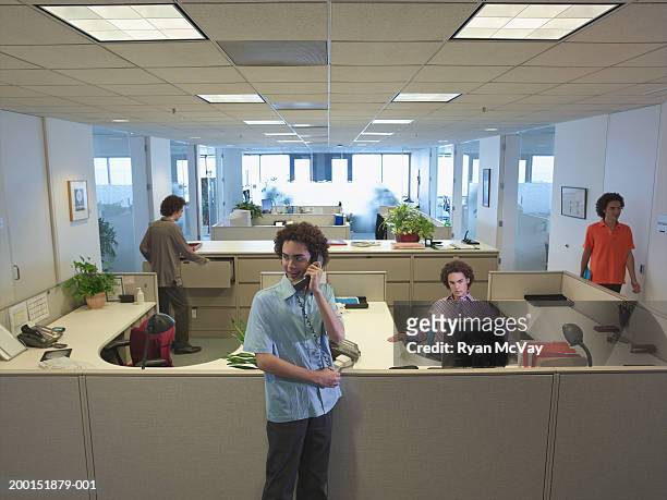 young man working in office (multiple exposure) - cloning stock pictures, royalty-free photos & images