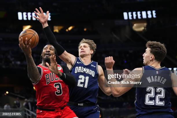 Andre Drummond of the Chicago Bulls drives to the basket against Moritz Wagner of the Orlando Magic during the fourth quarter at Kia Center on...