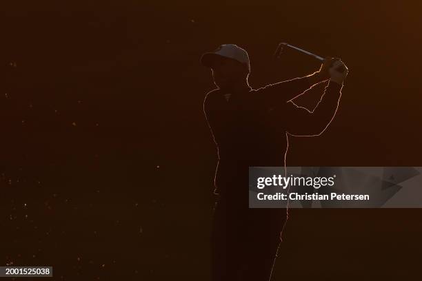 Daniel Berger of the United States plays his second shot on the ninth hole during the third round of the WM Phoenix Open at TPC Scottsdale on...