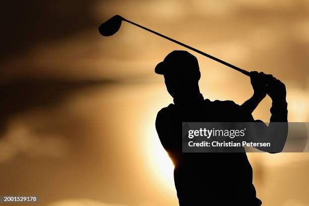 Daniel Berger of the United States plays a tee shot on the ninth hole during the third round of the WM Phoenix Open at TPC Scottsdale on February 10,...