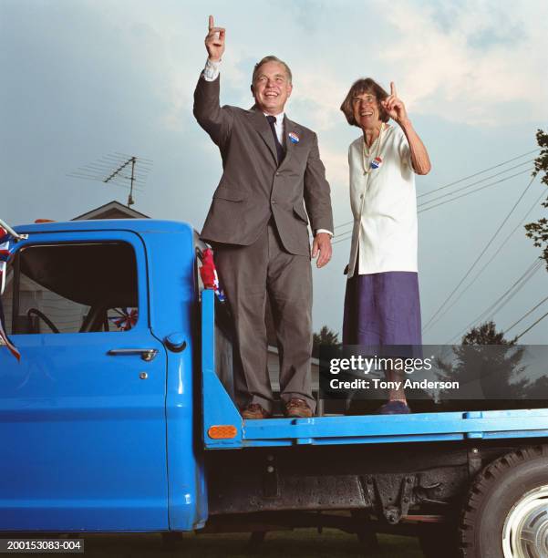 man and woman on back of truck campaigning - stoneplus5 stock pictures, royalty-free photos & images