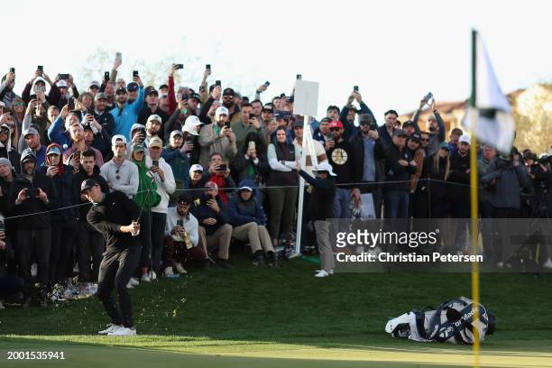 Jordan Spieth of the United States chips onto the fifth green during the third round of the WM Phoenix Open at TPC Scottsdale on February 10, 2024 in...
