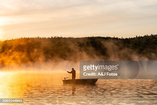 A senior man fishing at sunrise.