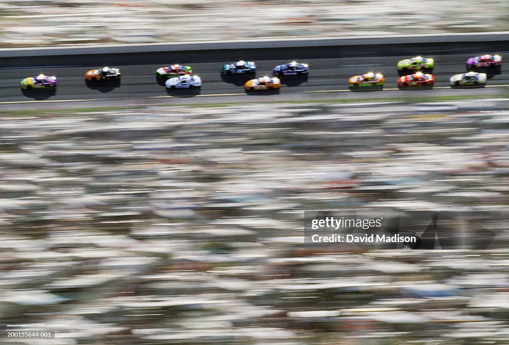 Stock cars racing around track (blurred motion, Digital Enhancement)