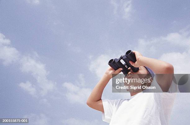 boy (8-10) looking through binoculars, low angle view - asian child with binoculars stock pictures, royalty-free photos & images