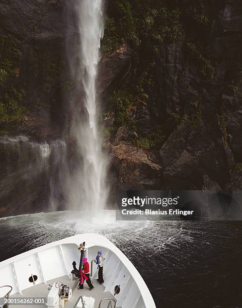 new zealand, milford sound, two girls (9-11) on tour boat - milford sound stock pictures, royalty-free photos & images