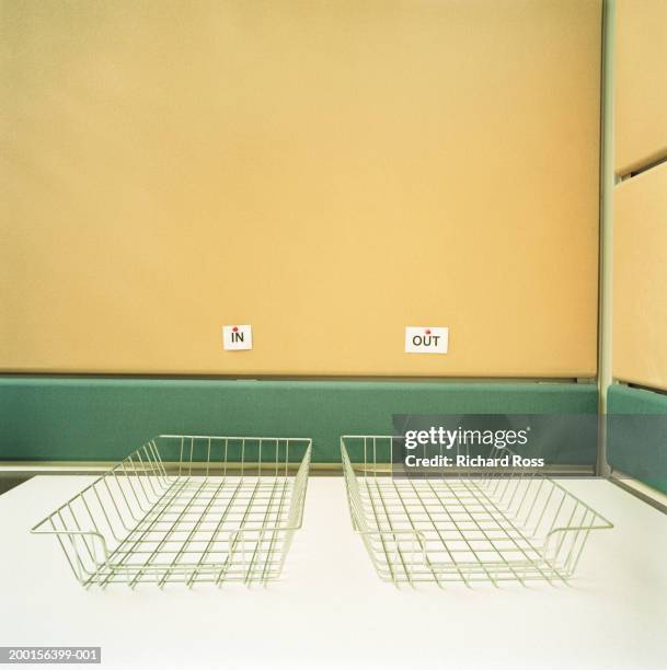 empty 'in and out' bins on desk - in out tray stock pictures, royalty-free photos & images