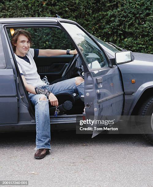 teenage boy (16-18) in driver's seat of car, portrait - sitting in car stock pictures, royalty-free photos & images