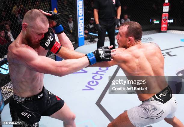 Jack Hermansson of Sweden punches Joe Pyfer in a middleweight fight during the UFC Fight Night event at UFC APEX on February 10, 2024 in Las Vegas,...