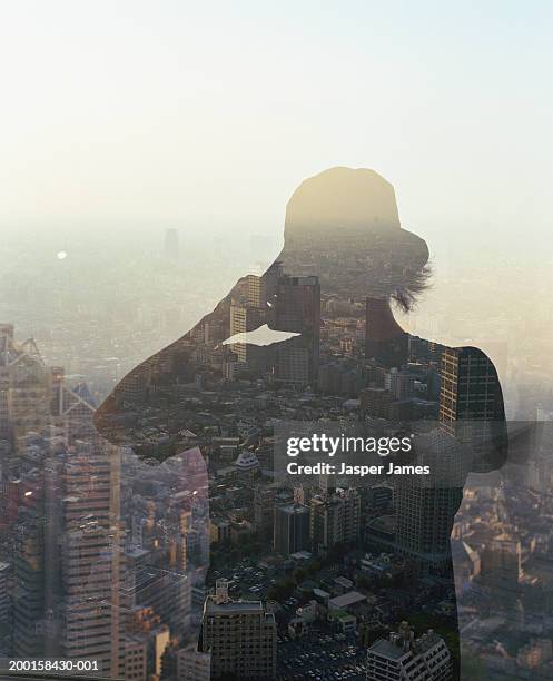 man taking photograph of cityscape from window (multiple exposure) - travel11 stock pictures, royalty-free photos & images