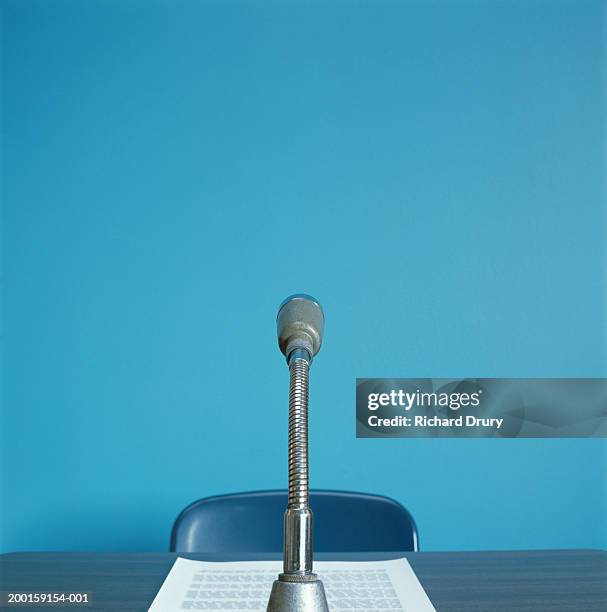 microphone on desk by paper - microphone desk fotografías e imágenes de stock