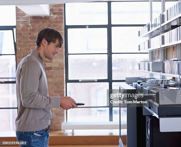Man Using Remote Control 855 Man Standing Remote Control Stock Photos, High-Res Pictures, and ...