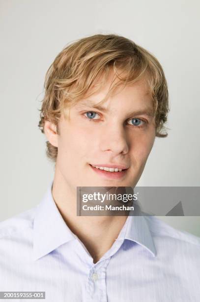 young man smiling, portrait, close-up - young man blue eyes stock pictures, royalty-free photos & images