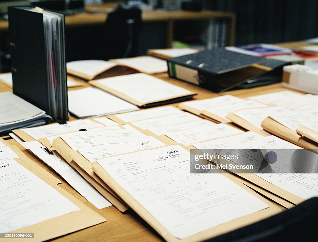 Paperwork and envelopes on desk