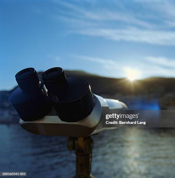 outdoor coin operated telescope at dusk, close-up - travel11 stock pictures, royalty-free photos & images