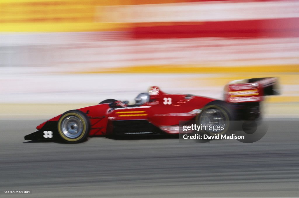 Racecar, side view (blurred motion, Digital Composite)