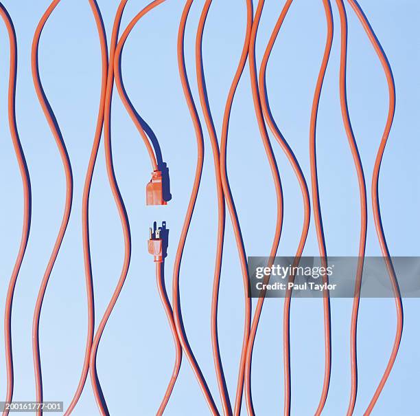 orange extension cords, elevated view - separation concept stock pictures, royalty-free photos & images