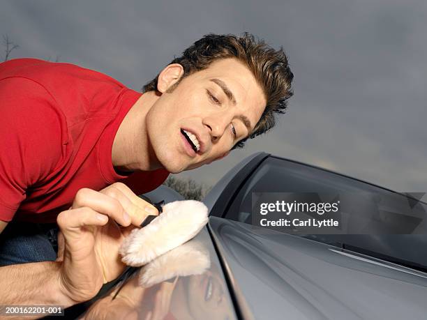 young man polishing car, close-up - polishing stock pictures, royalty-free photos & images