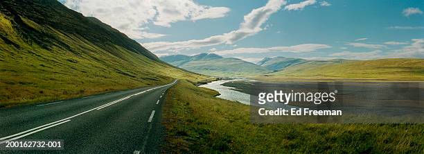 iceland, two lane road by stream (digital enhancement) - travel11 stock pictures, royalty-free photos & images