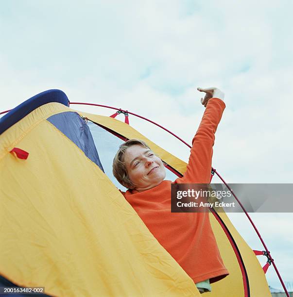 woman stretching in tent - travel12 stock pictures, royalty-free photos & images