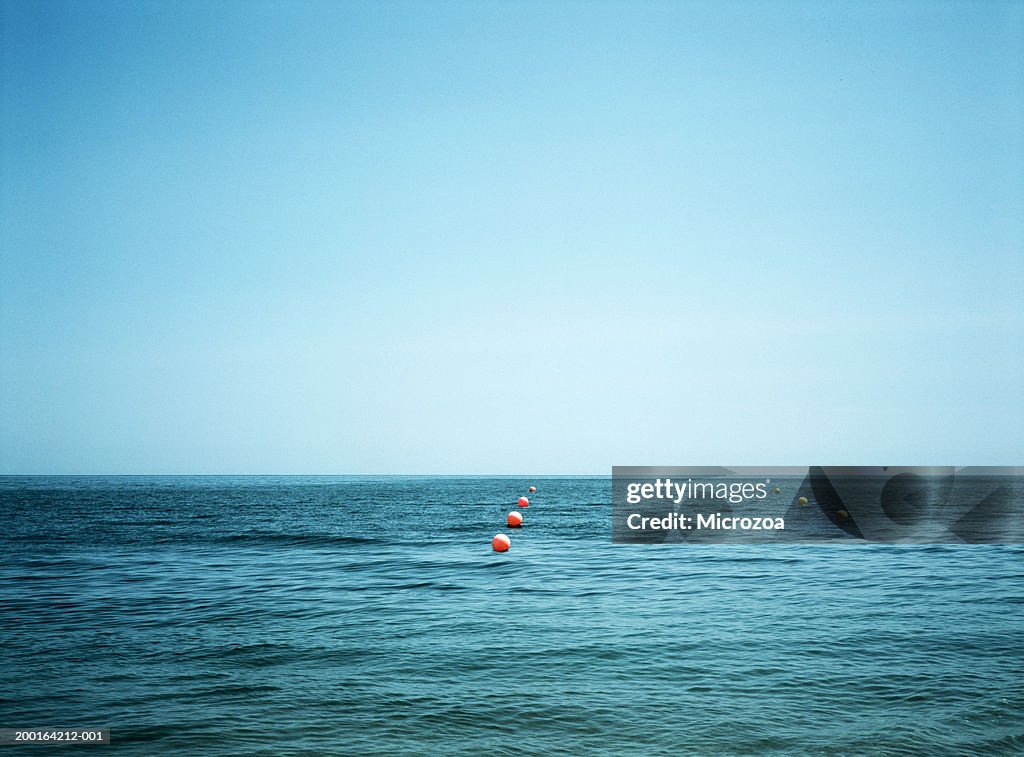 Seascape with red and yellow buoys