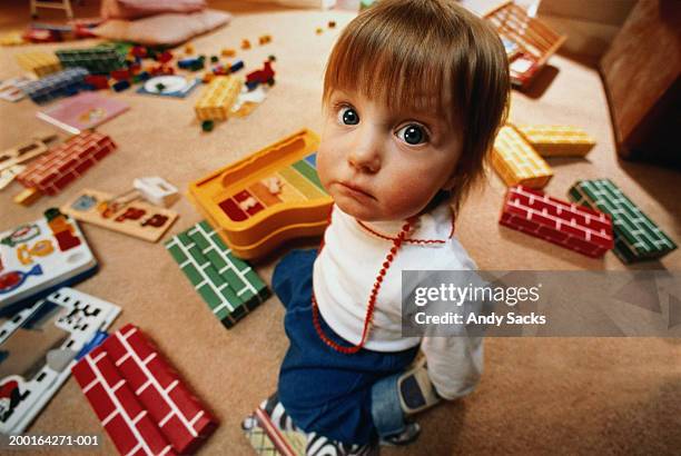 female toddler (12-15 months) in room with learning toys, portrait - one baby girl only - fotografias e filmes do acervo