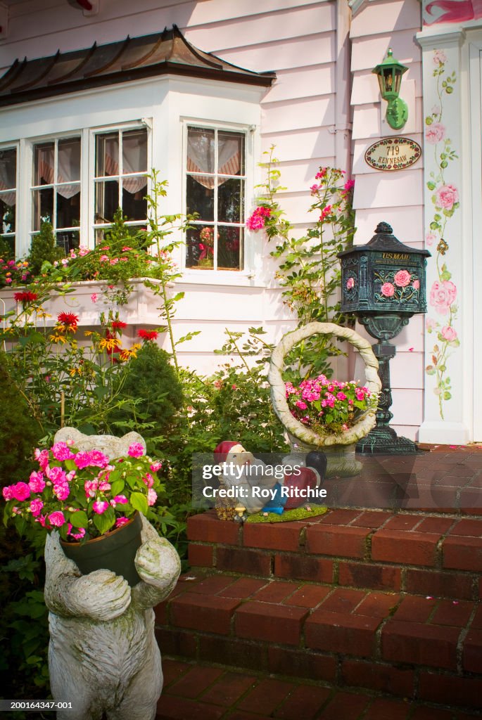 Lawn ornaments on brick front porch