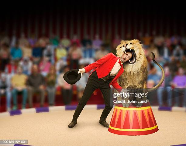 lion trainer's head inside lion's mouth (digital composite) - ライオン使い ストックフォトと画像