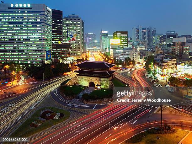 south korea, seoul, namdaemun gate and traffic, dusk, elevated view - namdaemun stockfoto's en -beelden