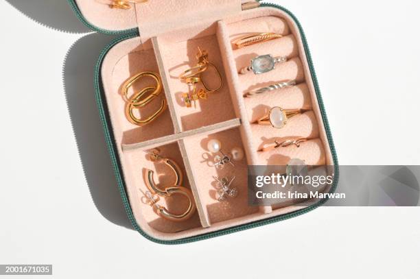 jewelry box filled with precious jewelry collection - pearl earring stock pictures, royalty-free photos & images