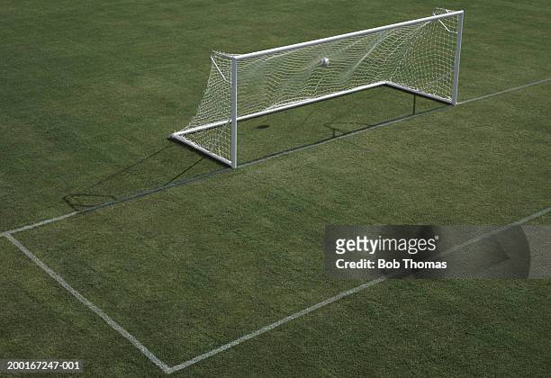 empty football pitch, ball in goal, elevated view - grande área local esportivo - fotografias e filmes do acervo