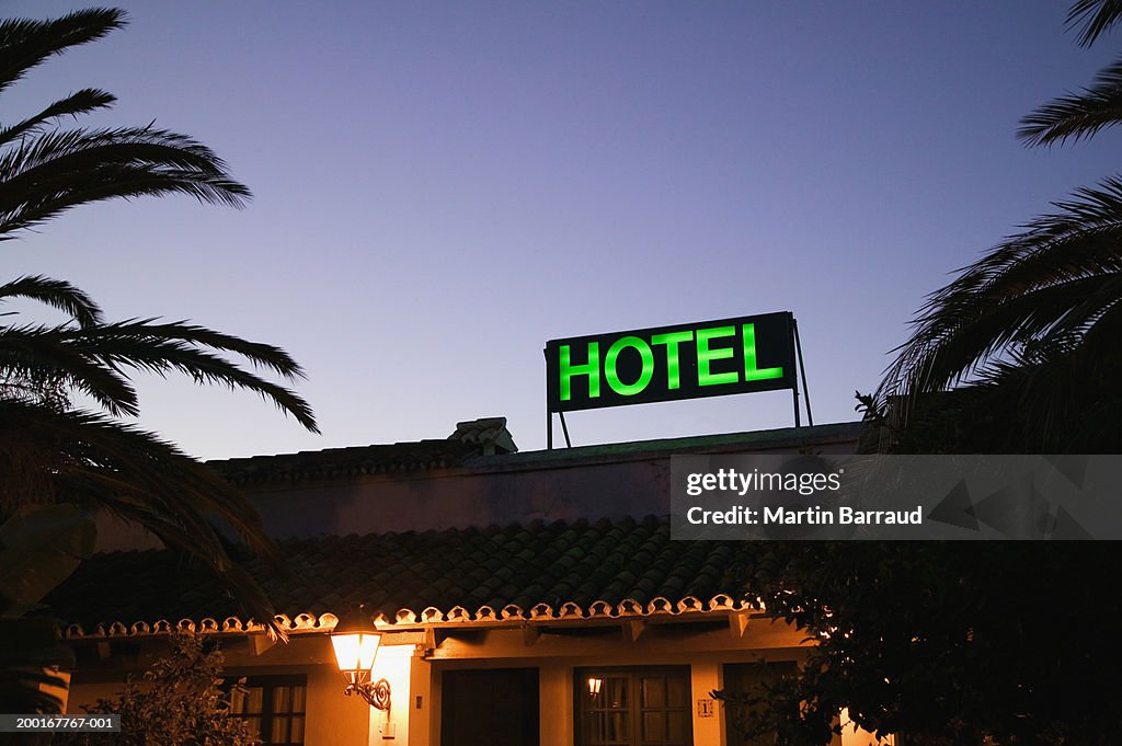 Hotel sign on roof, low angle view