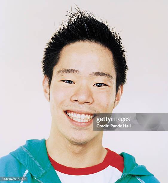 young man smiling, portrait, close-up - 18 years white background stock pictures, royalty-free photos & images