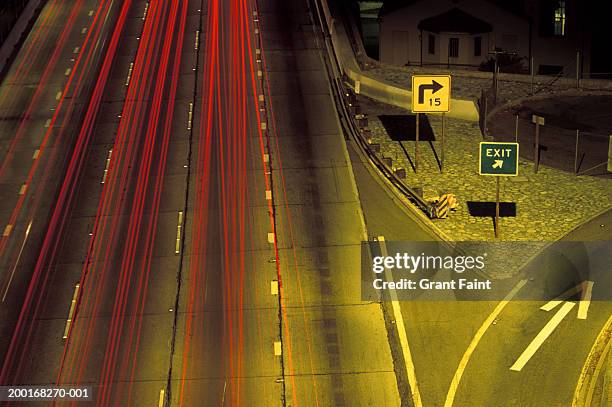 highway exit, elevated view (blurred motion) - highway exit sign stock pictures, royalty-free photos & images