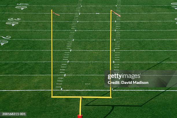 american football field with goal post, elevated view - goal posts stockfoto's en -beelden